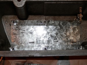 Damaged baffle in valve cover